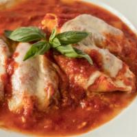 Stuffed Shells (4) · Shells stuffed with ricotta cheese & sautéed in a tomato sauce topped with mozzarella.