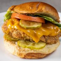 Royally Clucked · Topped with lettuce, tomatoes, onions, Cheddar and pickles.