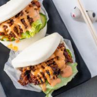 Spicy Pork Bun (2 Pcs) Max. 3 Order · Spicy. Barbequed spicy pork with cucumber, and lettuce in a steamed bun.