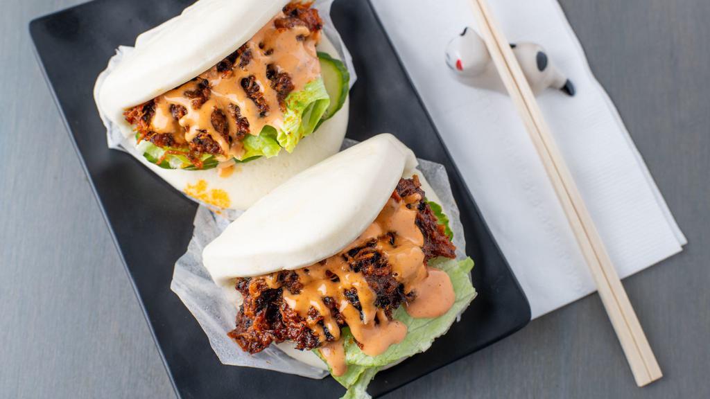 Spicy Pork Bun (2) · Spicy. Barbecued spicy pork with cucumber and lettuce in a steamed bun.