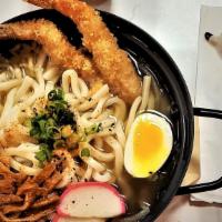 Tempura Nabe Udon · Two shrimp  tempura with fish cake, and served on udon noodle in dashi broth.