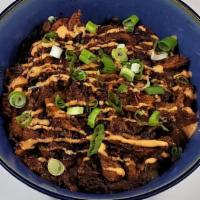 Spicy Pork Donburi · Spicy. Shredded barbecued spicy pork over rice with sautéed onions and negi.