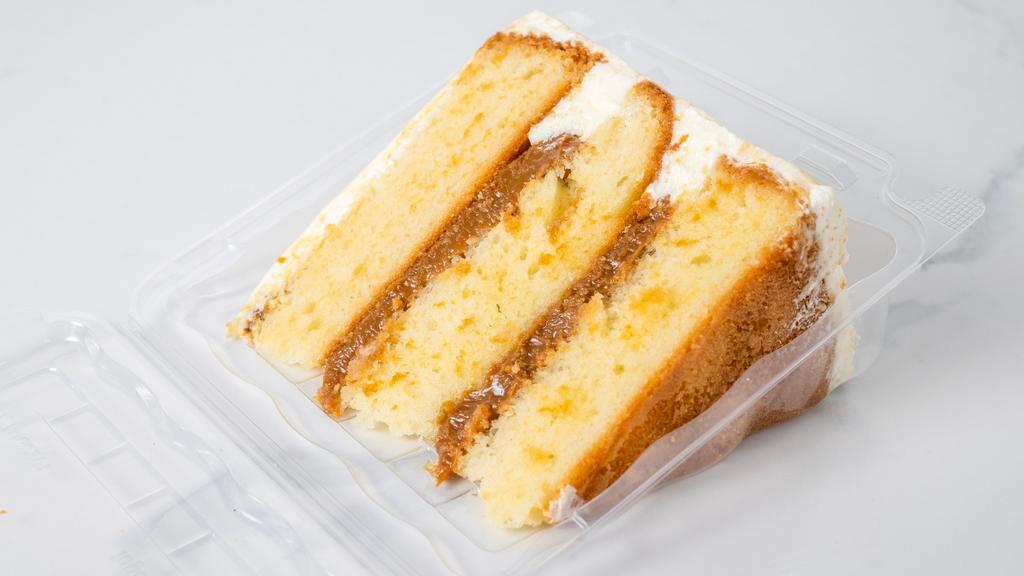 8'' Dulce De Leche Cake · Vanilla cake with dulce de leche filling.