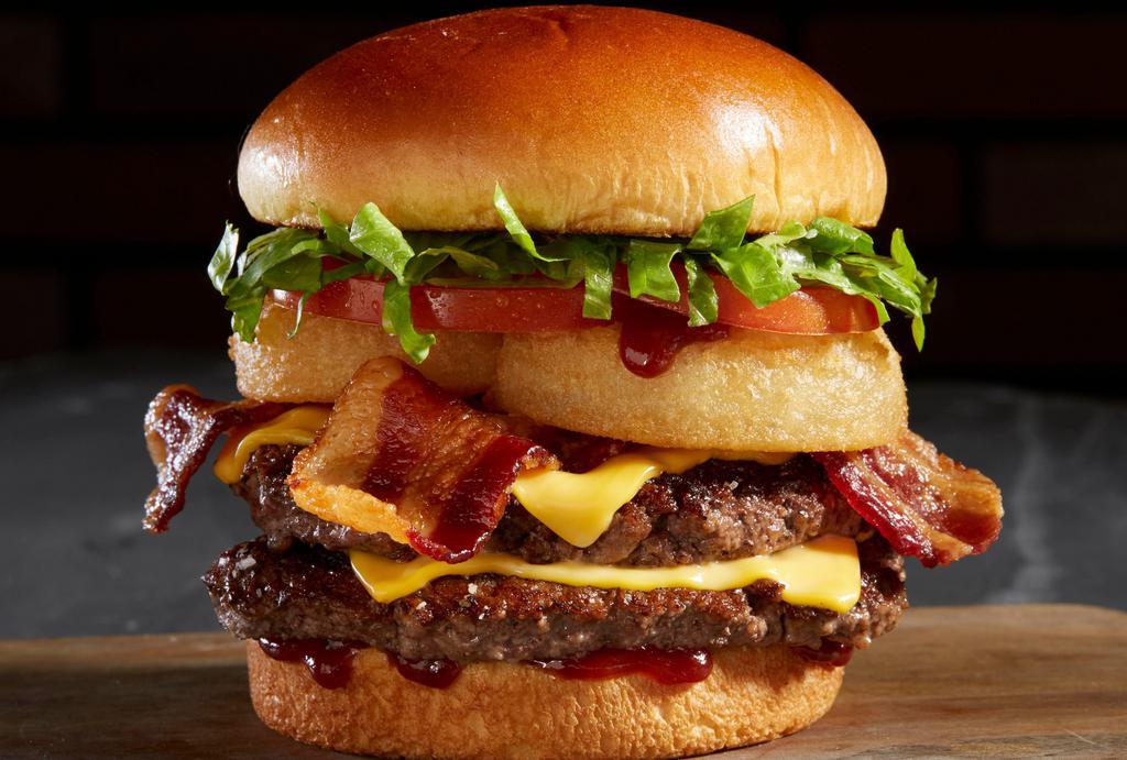 Bbq Bacon Tribeca Burger · 1/2 Lb Angus Beef Patty, BBQ Sauce, Ranch, Cheese, Bacon, Onion Rings, Lettuce and Tomato. Combo includes fries and drink.