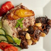 Stew Oxtail · Served with plantains a choice of rice and a choice of vegetables