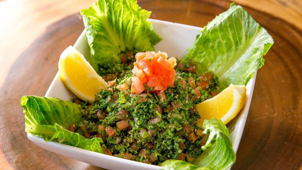 Taboule · Vegetarian. Authentic parsley salad with burghul mixed with chopped onions, tomatoes, olive oil and fresh lemon juice.