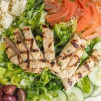 Chicken Meshwe · Chargrilled marinated boneless chicken over a mixture of greens, black olives, cucumbers, to...