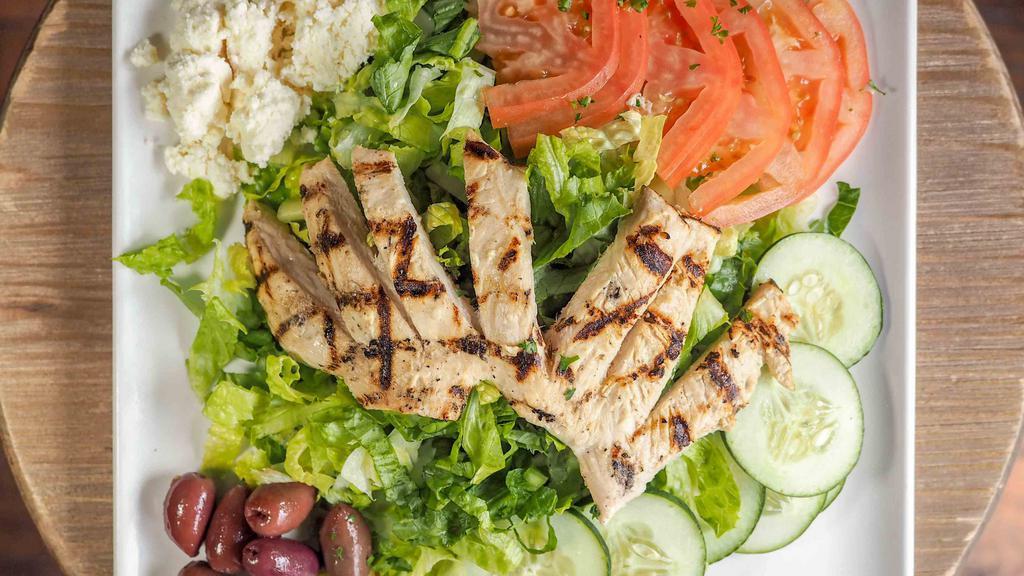 Chicken Meshwe · Chargrilled marinated boneless chicken over a mixture of greens, black olives, cucumbers, tomatoes and feta cheese. Served with choice of dressing.