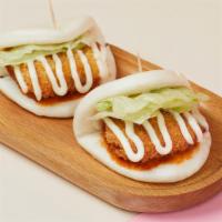 Fried Chicken Buns · Steamed buns filled with crispy chicken, served with homemade chili sauce and mayo. Spicy.
E...