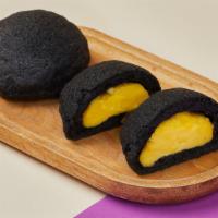 Lava Bào · Sweet baked buns with black  sesame with homemade custard and coconut milk.
Each order comes...