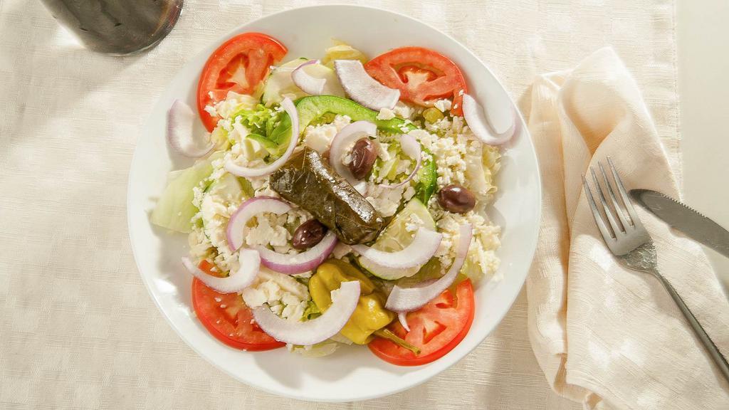 Greek Salad (Small) · Greek salad with romaine lettuce, fresh tomatoes, cucumbers, feta cheese, black olives & red onions with our homemade dressing.