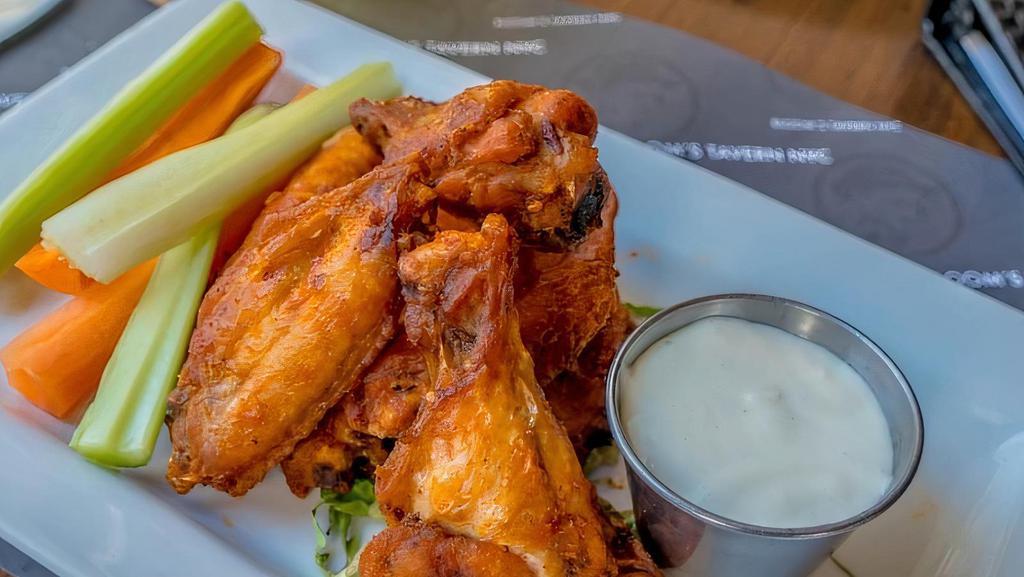 Dry Rubbed Chicken Wings · Choose from siracha honey sauce, buffalo or Bbq style.
