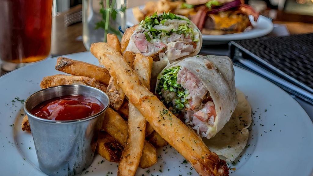 Tuna Steak Wrap · Served with lettuce and tomato in a flour tortilla wrap with wasabi mayo.