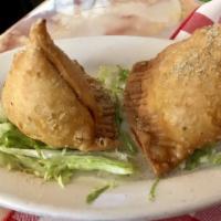 Chicken Samosas · Hungry Bird favorite: India's most popular snack - pastry with a filling of minced masala ch...