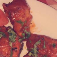 Masala Wings · Chicken wings with a side of mild or vindaloo (spicy) sauce.