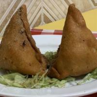 Vegetable Samosa · Vegan. Hungry Bird favorite: India's most popular snack- pastry with filling of spiced peas ...