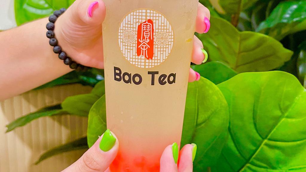 Lychee Legend · Jasmine green tea with lychee syrup and freshly squeezed lemon juice, topped with strawberry bursting boba.
