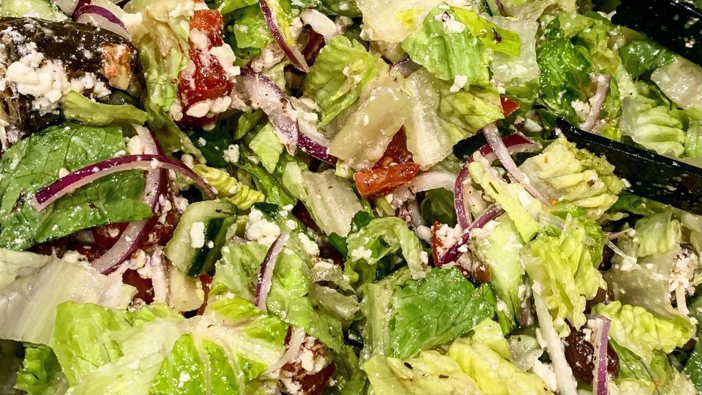 Greek Salad · Romaine, tomato, cucumber, onion, grape leaves, olives and feta.