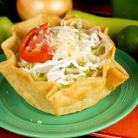 Taco Salad · A fried flour tortilla with your choice of ground beef, shredded chicken, topped with cheese...