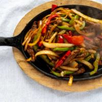 Fajitas · Tender strips of chicken, steak or both grilled to perfection with bell peppers, onion, and ...