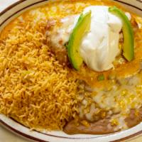 Chimichanga · Two deep fried flour tortillas filled with chicken or shredded beef topped with queso served...