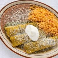 Enchiladas Suizas · Three chicken enchiladas topped with cheese sauce, green sauce, and cilantro. Served with ri...