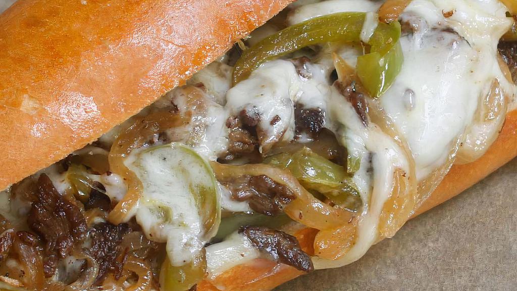 Philly Cheese Steak · Grilled roast beef w fried onions, mozzarella & brown gravy