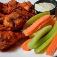 Buffalo Wings · Jumbo wings prepared with buffalo sauce and served with bleu cheese.
