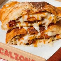 The Barclays Calzone · Calzone with sausage, pepperoni, bacon, ham, melted mozzarella, and a side of marinara.