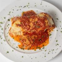 Baked Bolognese Lasagna · Our homemade Bolognese sauce layered with pasta, ricotta, fresh mozzarella and Italian herbs...