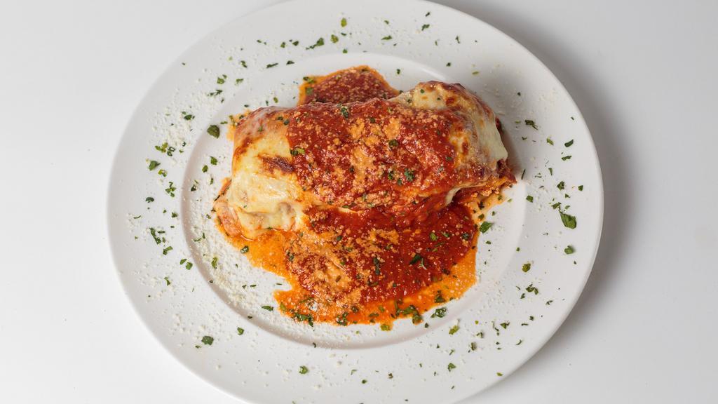 Baked Bolognese Lasagna · Our homemade Bolognese sauce layered with pasta, ricotta, fresh mozzarella and Italian herbs topped with marinara and melted mozzarella cheese.
