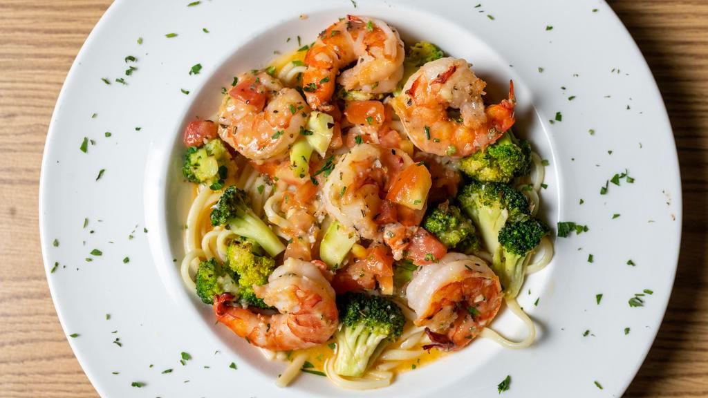 Shrimp Scampi Verdi · Sautéed shrimp with broccoli and diced tomatoes in a garlic lemon white wine sauce, over linguini pasta.