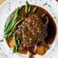 Mulberry Filet Mignon · Center cut 10-ounce filet mignon, served with a portabella mushroom cap in a cabernet demi-g...