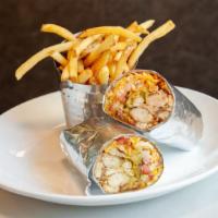 Grilled Crunch Wrap · Grilled chicken, guacamole, crispy onion rings, tortilla strips, tomato, Monterrey Jack chee...