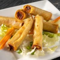 Shanghai Lumpia(Ground Pork Egg Rolls-6 Pieces) · Minced pork with water chestnut, onion, carrots and seasoning. Wrapped in spring roll wrappe...