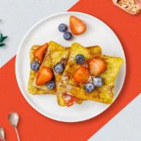 Top Of French Toast · French toast topped with blueberries, strawberries, and banana.