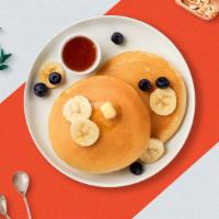 Berry Top Pancakes · Buttermilk pancakes with blueberries, strawberries, and banana.