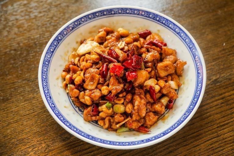 Kung Pao Chicken宫保鸡丁 · Dice chicken stir fried with peanut, dried chili pepper, and garlic. Spicy. Rice not included.