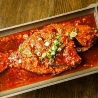 Braised Whole Fish With Sweet Bean Paste Sauce豆瓣全鱼 · Unlike the flamingly hot roast whole fish , this braised fish is significantly. milder, and ...