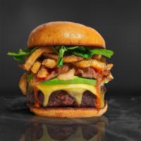 French Fries Burger · Half pound beef patty topped with fries, avocado, caramelized onions, ketchup, lettuce, toma...