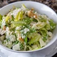 Caesar Salad. · Romain hearts, focaccia croutons, shaved parmesan, house caesar dressing.