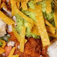 Fiesta Salad. · Crispy chicken, black beans, corn, shredded cheese, cilantro, pico de gallo, guacamole, tort...