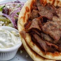 Gyro. · grecian lamb, romaine, tomato, red onion, tzatziki in pita. greek salad & fries