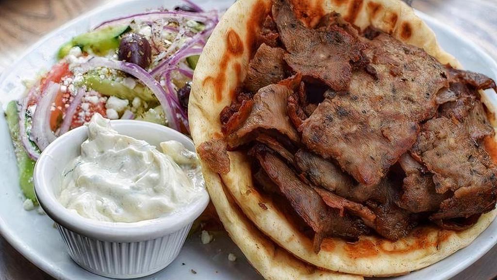 Gyro. · grecian lamb, romaine, tomato, red onion, tzatziki in pita. greek salad & fries