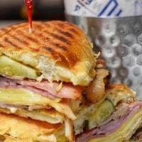 Cuban Sandwich. · marinated roast pork shoulder, sugar cured ham, swiss, sour pickles, mayo, dijon, plancha'd ...
