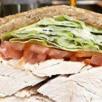 Famous Hand Carved Turkey Sandwich · served with cole slaw & pickle