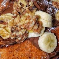 Nutella French Toast.. · Nutella, banana, walnuts and whipped cream. Served with sweet butter and syrup.