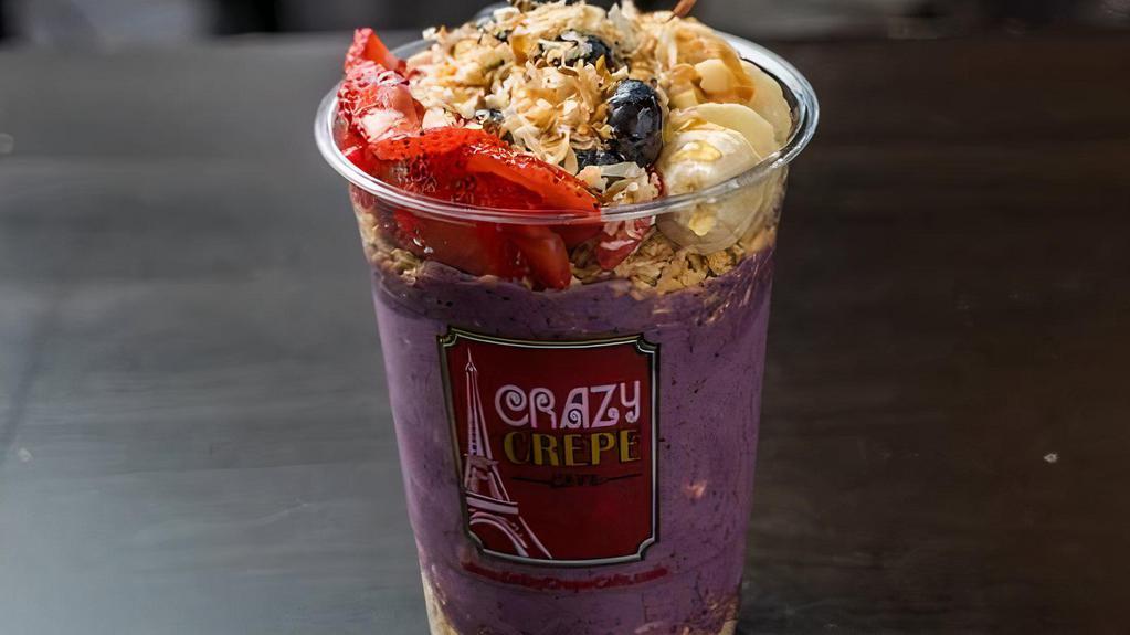 Acai Bowl · Topped with blueberries, strawberries, bananas, granola, honey, toasted coconut.