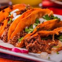 Beef Birria (Rez) · Four beef & cheese  tacos topped with cilantro and onion. With a side of  consome. 4 tacos d...