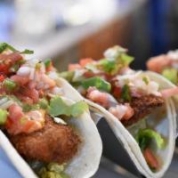 Crispy Fish Tacos · Crispy cod, baja sauce, guacamole, pico de gallo.